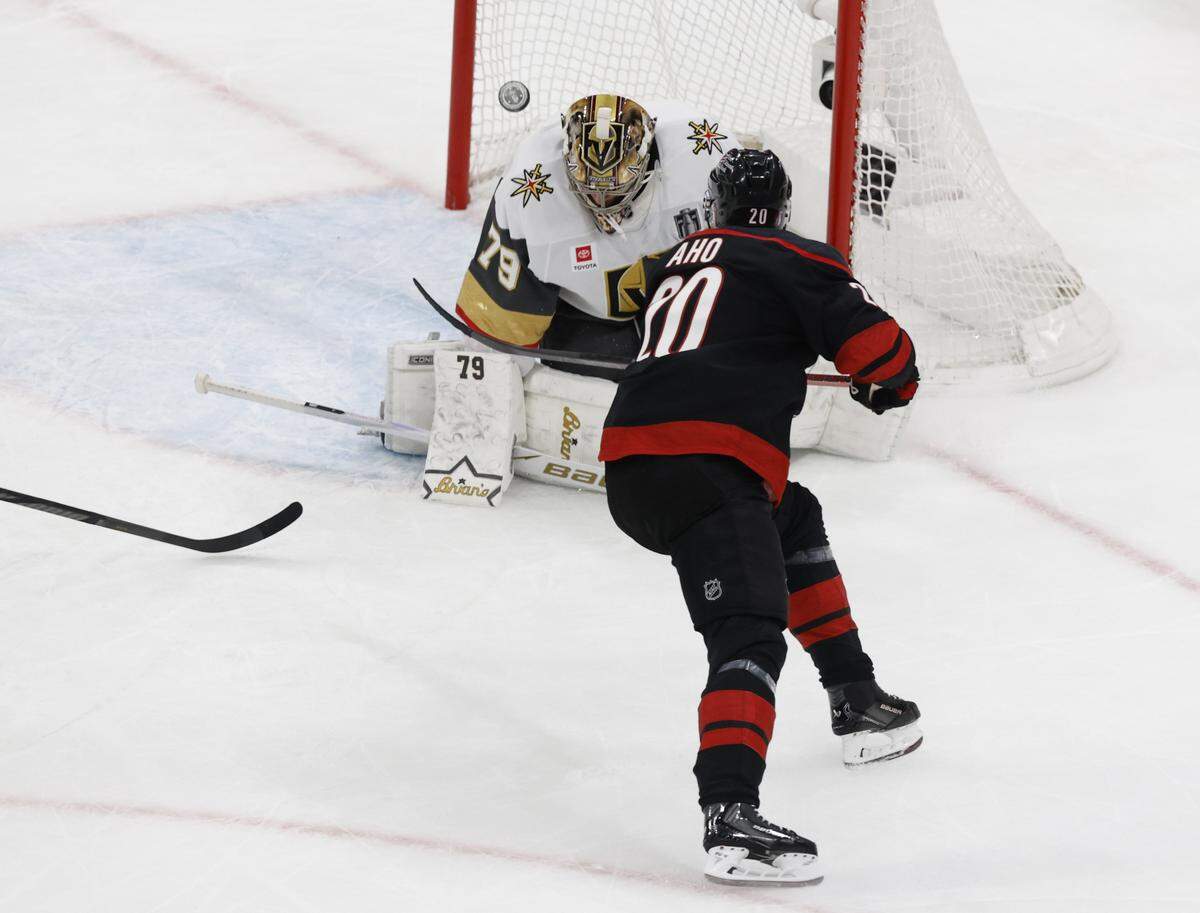 Vegas’ Carter Hart (79) breaks up the shot by Carolina's Sebastian Aho (20) in the second period of the Hurricanes’ game against the Golden Knights in the first game of the Stanley Cup Final at the Lenovo Center in Raleigh, N.C., Tuesday, June 2, 2026.