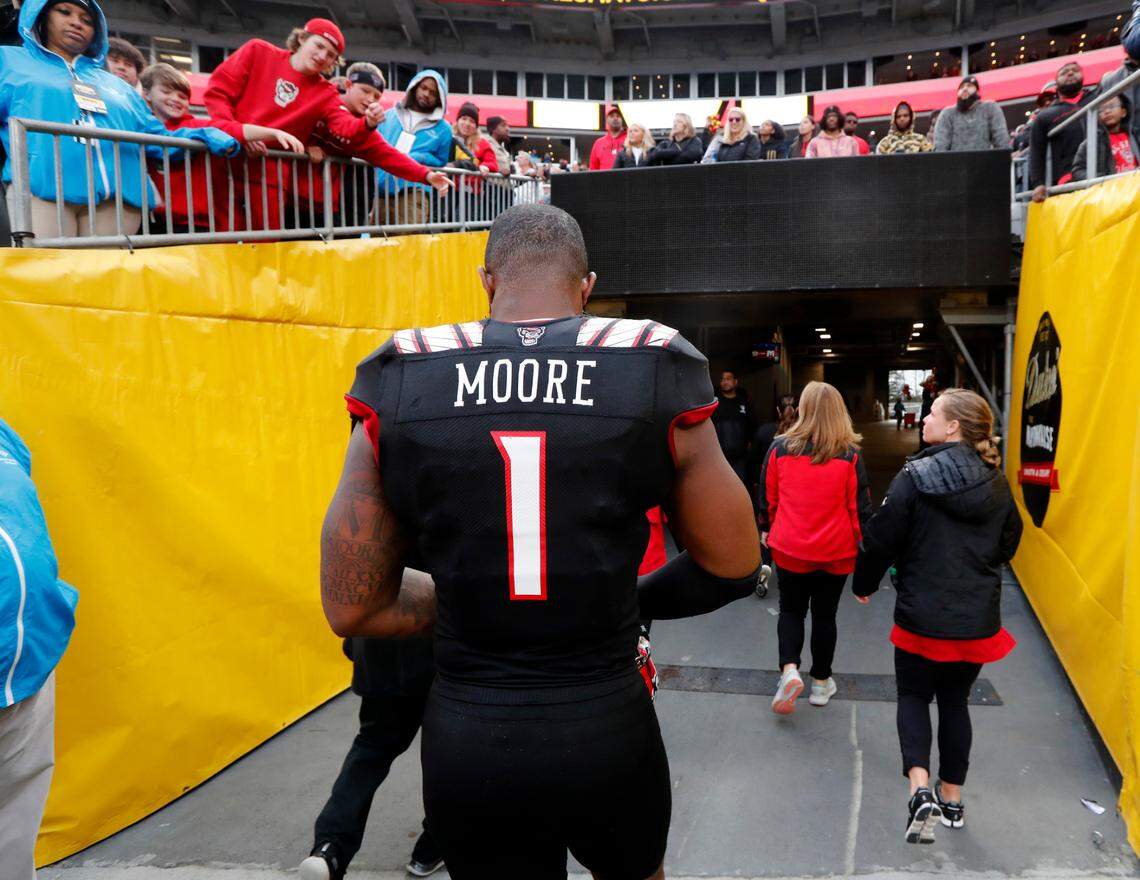 N.C. State linebacker Isaiah Moore (1) walks off the field after Maryland’s 16-12 victory over N.C. State in the Duke’s Mayo Bowl at Bank of America Stadium in Charlotte, N.C., Friday, Dec. 30, 2022.