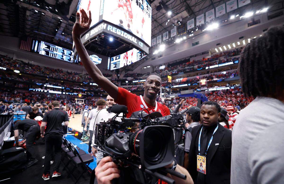 N.C. State’s Mohamed Diarra (23) celebrates as he comes off the court after N.C. State’s 67-58 victory over Marquette in their NCAA Tournament Sweet 16 game at the American Airlines Center in Dallas, Texas, Friday, March 29, 2024.