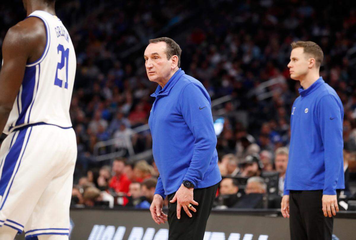 Duke head coach Mike Krzyzewski talks with AJ Griffin (21) and the team after a timeout in the second half of Duke’s 78-73 victory over Texas Tech in the Sweet 16 round of the NCAA Tournament at the Chase Center in San Francisco, Calif., Thursday, March 24, 2022.