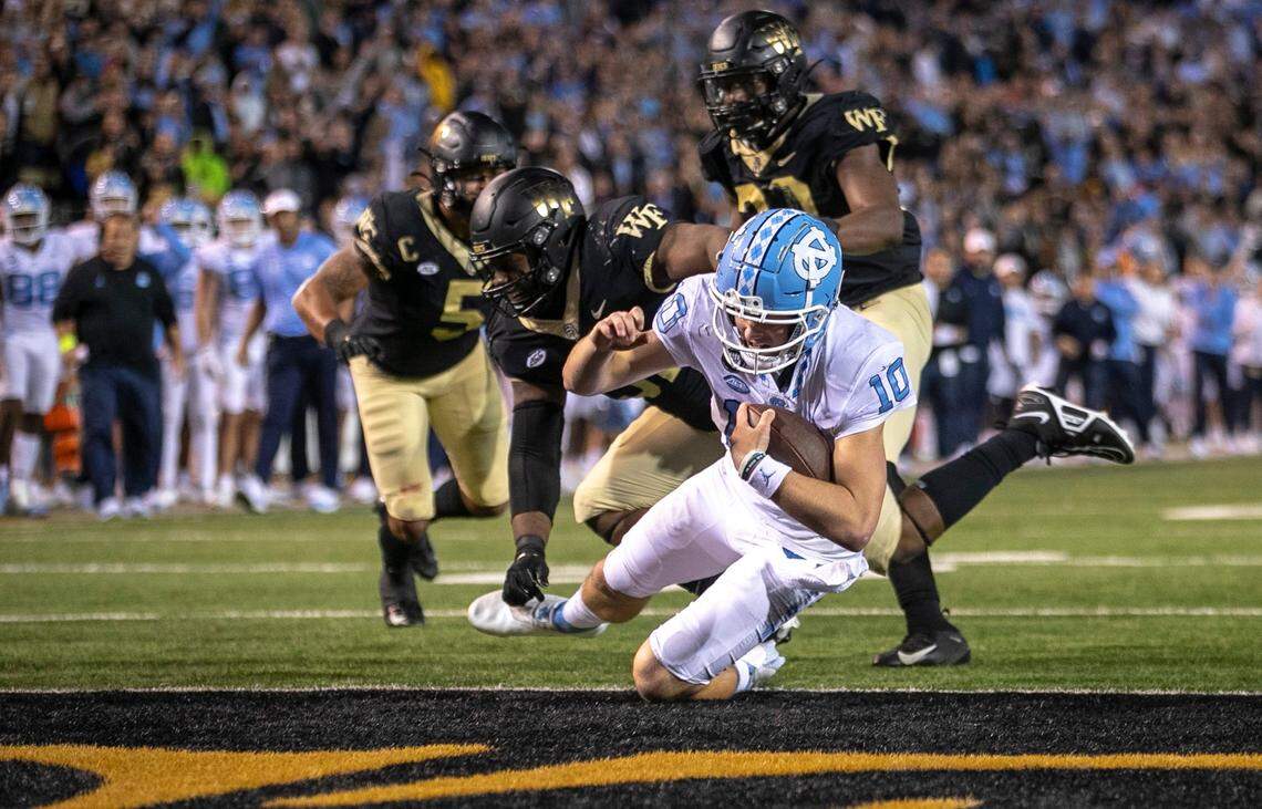 North Carolina quarterback Drake Maye (10) scores on a five-yard run to give the Tar Heels a 33-28 lead in the third quarter against Wake Forest on Saturday, November 12, 2022 at Truist Field in Winston-Salem, N.C.