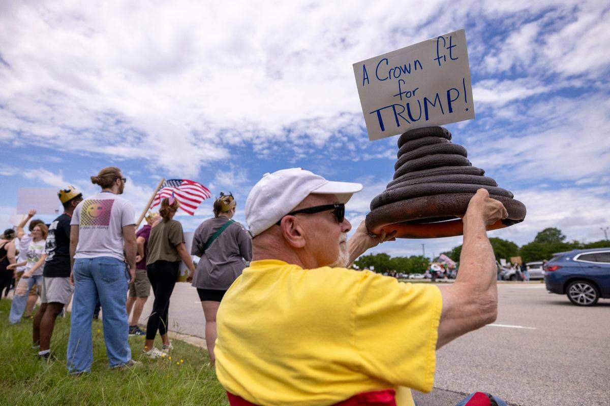 More than 1500 demonstrators lined Capital Boulevard to protest the policies and tactics of the of President Donald Trump on Saturday, June 14, 2025 near Triangle Town Center in Raleigh. The Raleigh “No Kings” rally was one of dozens across North Carolina and hundreds nationwide on what organizers called a nationwide day of defiance against the Trump administration.