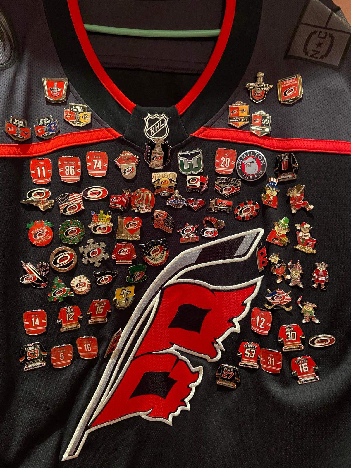 Dave Pulver of Ayden, N.C. collects pins for his Carolina Hurricanes sweater.