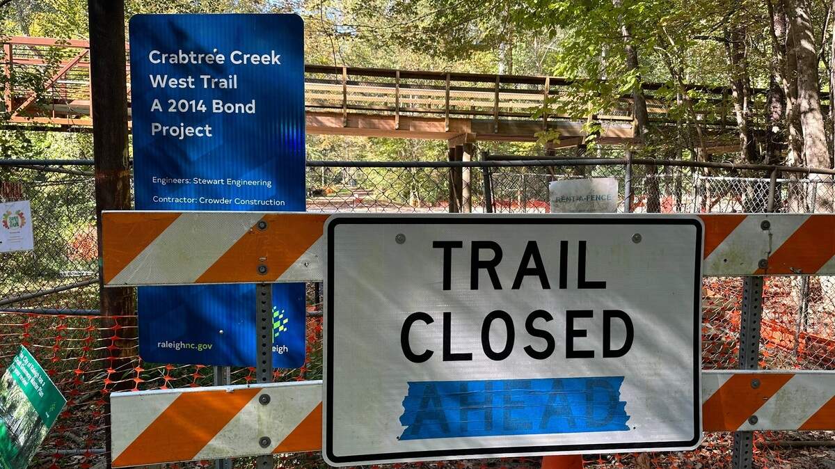 The City of Raleigh can’t say when it will finish the final two-thirds of a mile of the Crabtree Creek Trail near Duraleigh Road. City contractors are awaiting steel cable for a suspension bridge that will carry the greenway trail over the creek.