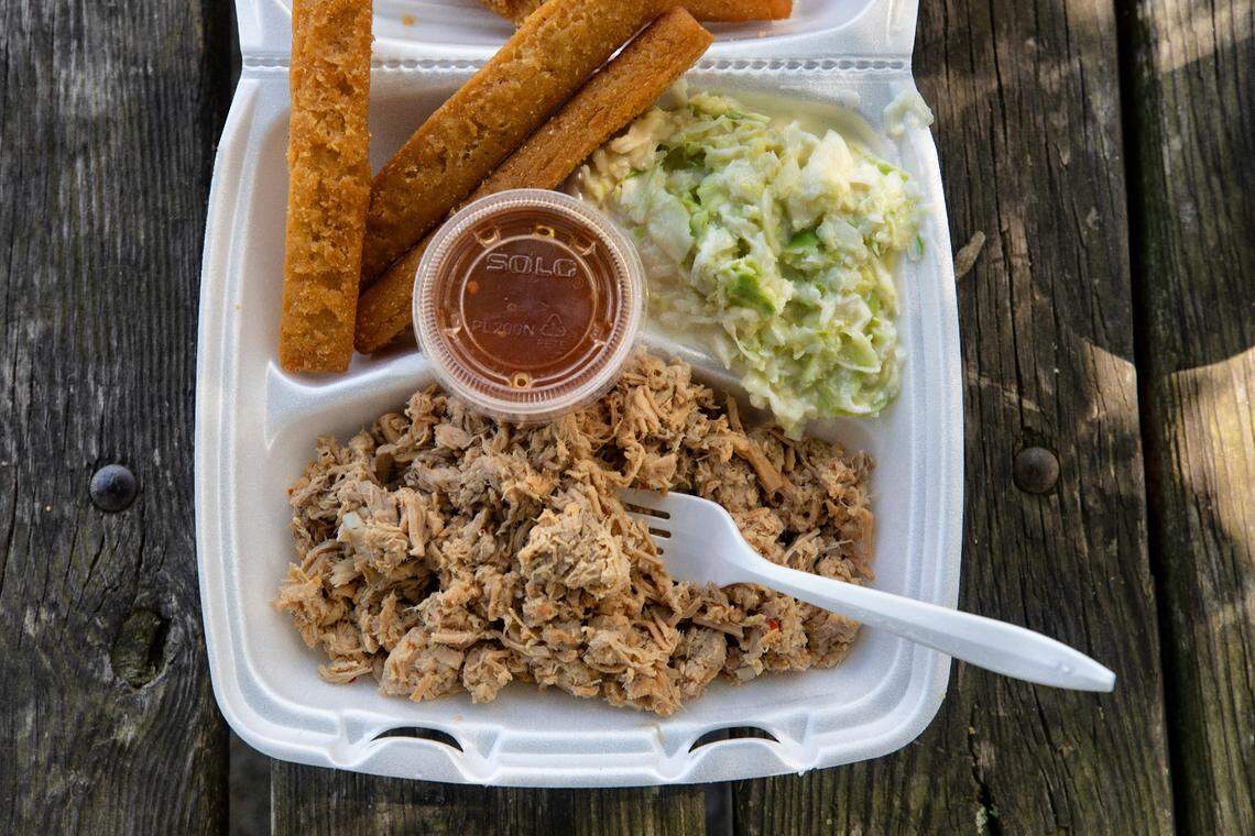 A simple barbecue plate at B’s in Greenville, N.C. features chopped pork, slaw, corn sticks, and vinegar-based sauce.