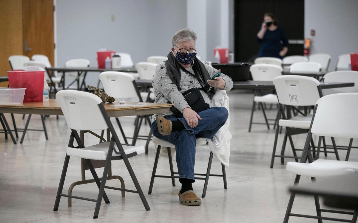 Cindy Bordeaux of Holly Springs, N.C. waits the required 15 minutes after receiving her second dose of the COVID-19 vaccine during a mass vaccination clinic at the Dunn Community Center on Friday, February 12, 2021 in Dunn, N.C. Harnett Health administered 1027 doses of the vaccine in four hours on Friday.