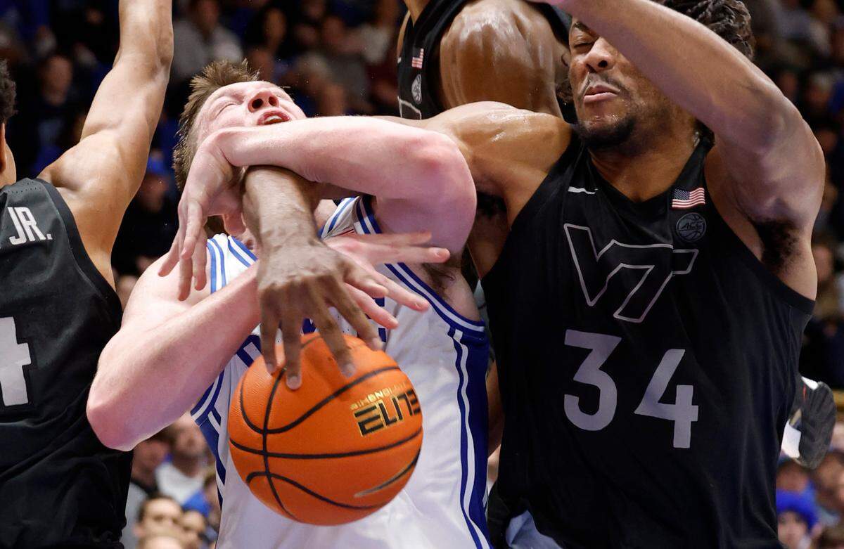 Duke’s Kon Knueppel (7) is fouled by Virginia Tech’s Mylyjael Poteat (34) during the second half of Duke’s 88-65 victory over Virginia Tech at Cameron Indoor Stadium in Durham, N.C., Tuesday, Dec. 31, 2024.