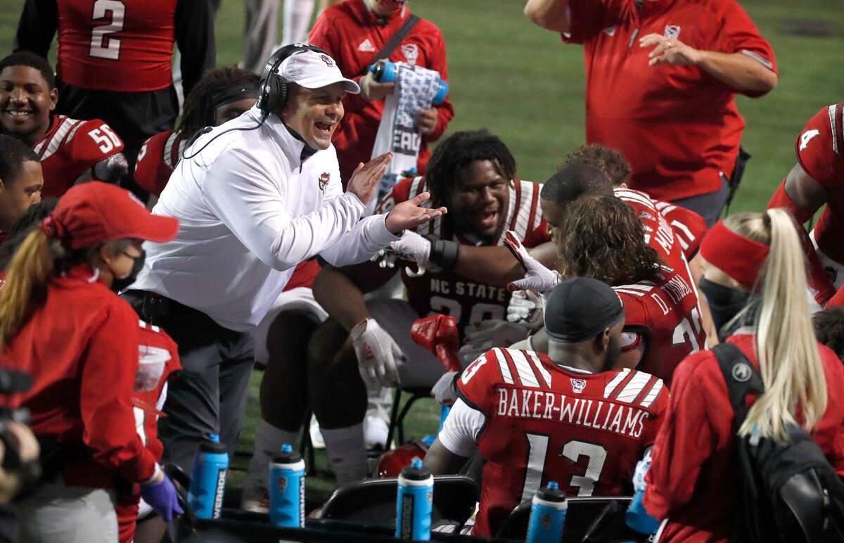 N.C. State defensive coordinator Tony Gibson encourages the defense during the second half of N.C. State’s 15-14 victory over Liberty at Carter-Finley Stadium in Raleigh, N.C., Saturday, Nov. 21, 2020.