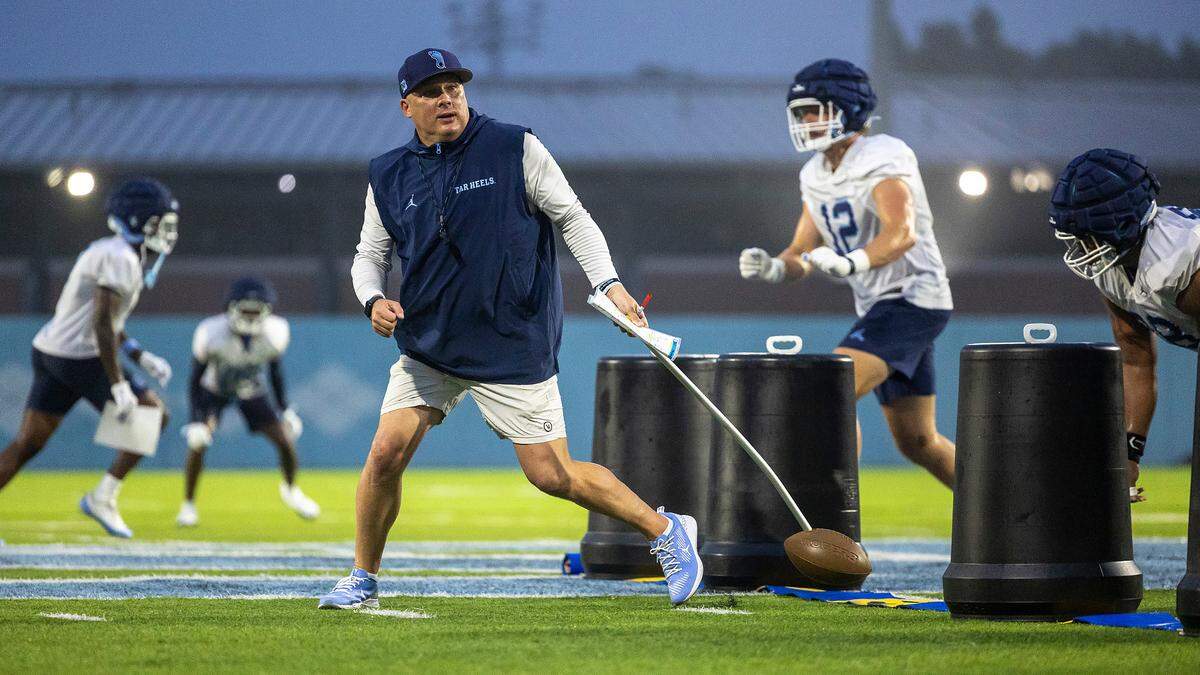 North Carolina defensive coordinator Geoff Collins works with his players during the Tar Heels’ first practice of the season on Monday, July 29, 2024 in Chapel Hill, N.C.