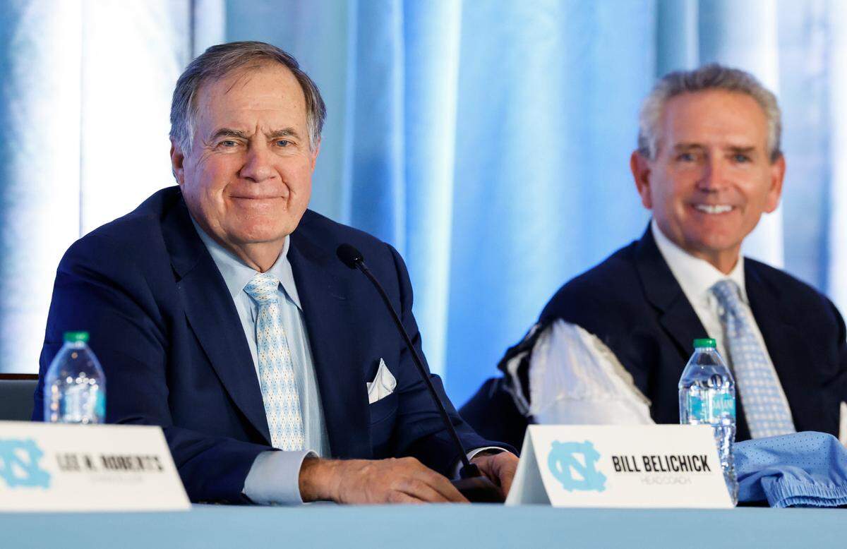 New North Carolina head football coach Bill Belichick listens to a question during a press conference announcing his hiring at the Loudermilk Center for Excellence at UNC in Chapel Hill, N.C., Thursday, Dec. 12, 2024. AD Bubba Cunningham sits to the right.
