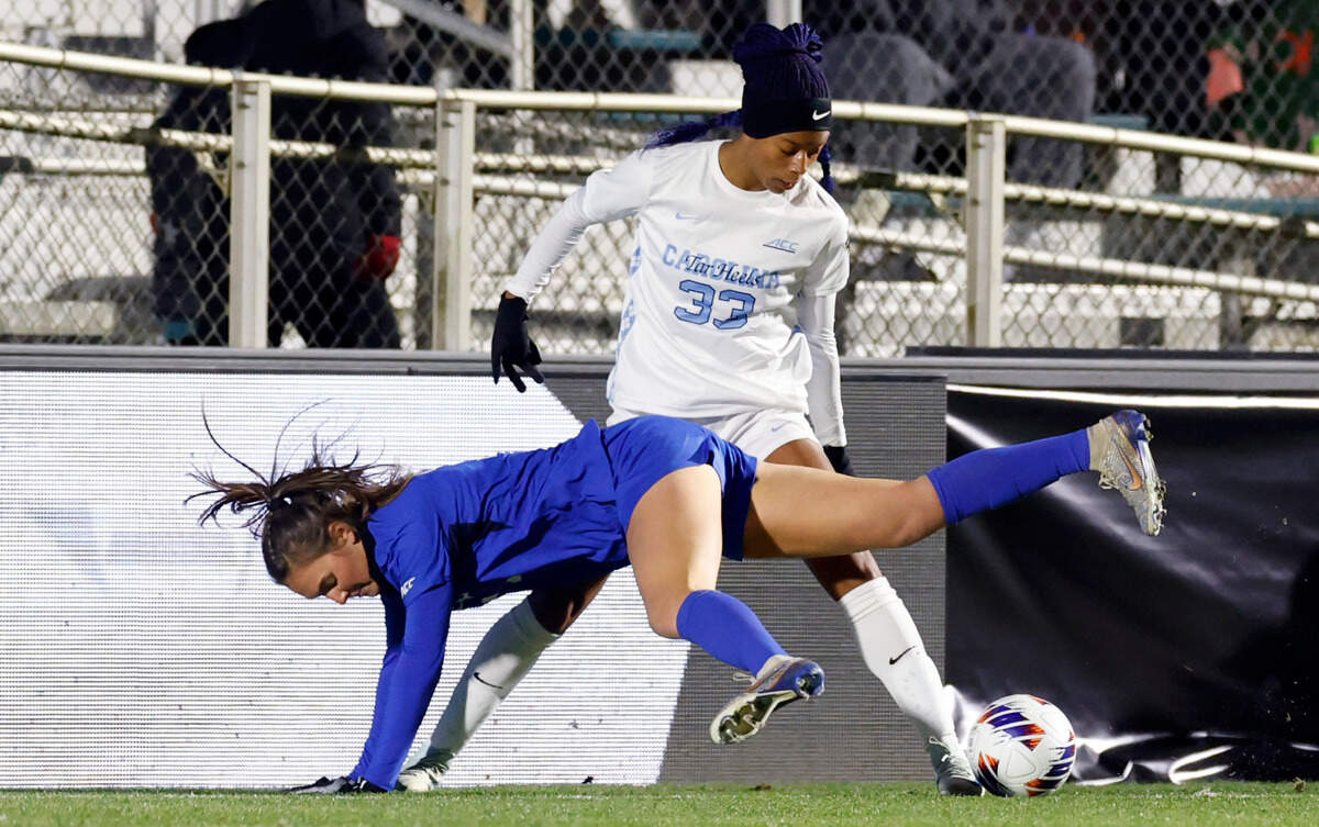 North Carolina’s Olivia Thomas (33) tangles with Duke’s Cameron Roller (7) during the first half of UNC’s game against Duke in the semifinals of the 2024 Women’s College Cup at WakeMed Soccer Park in Cary, N.C., Friday, Dec. 6, 2024.