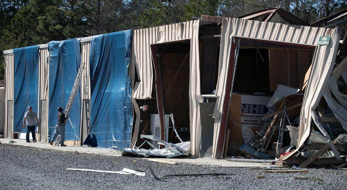 Tarps are installed at Ocean Ridge Storage Solutions which suffered extensive damage on Seaside Road in Sunset Beach, N.C. on Tuesday, February 16, 2021 after a tornado ripped through the Brunswick County community late Monday night.