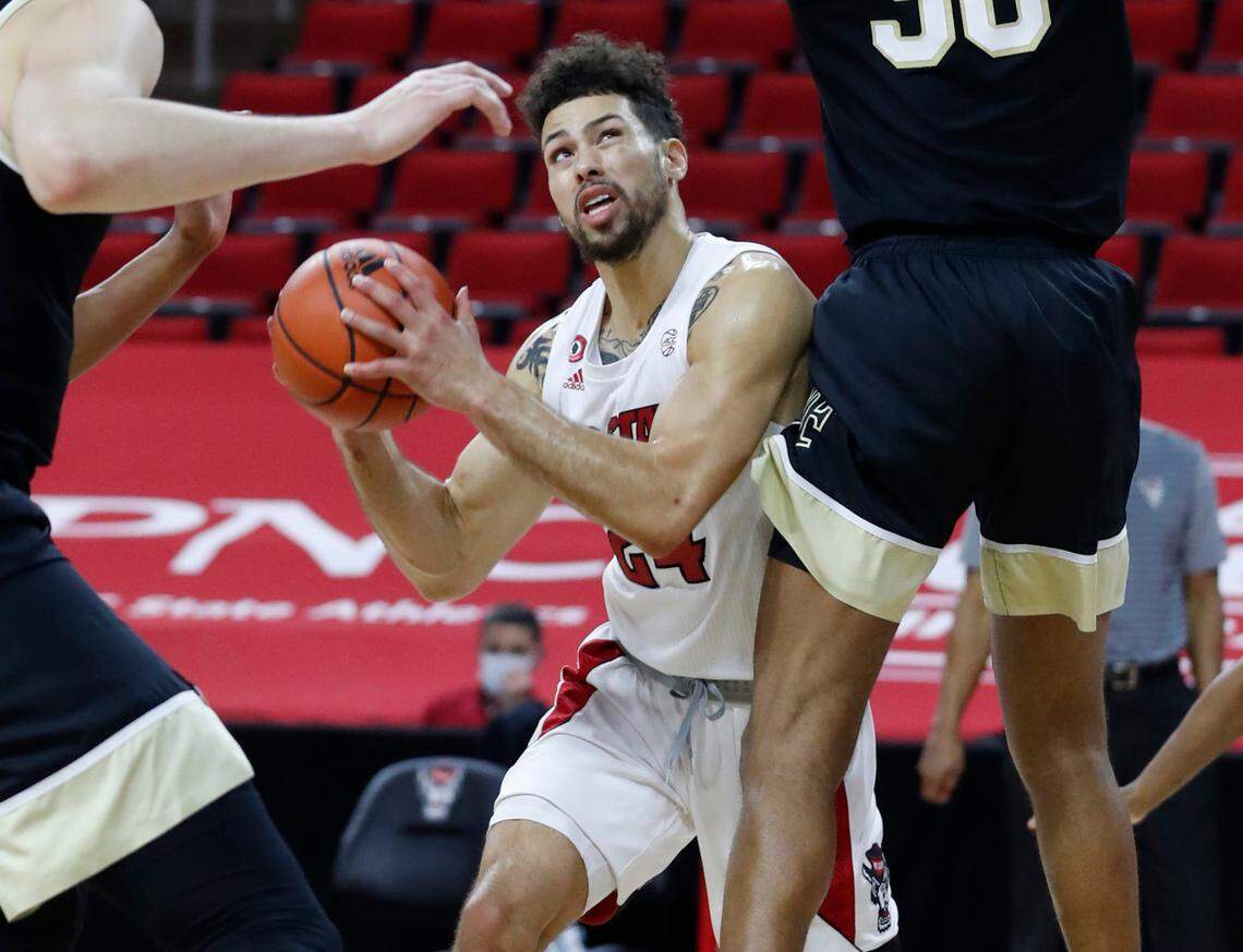N.C. State’s Devon Daniels (24) looks for room to shoot during the second half of N.C. State’s 72-67 victory over Wake Forest at PNC Arena in Raleigh, N.C., Wednesday, January 27, 2021.