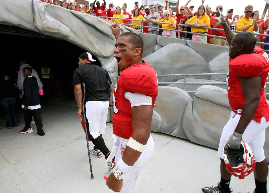 N.C. State’s Russell Wilson celebrates as he leaves the field after the Wolfpack’s 30-24 overtime victory over East Carolina in Raleigh in 2008.