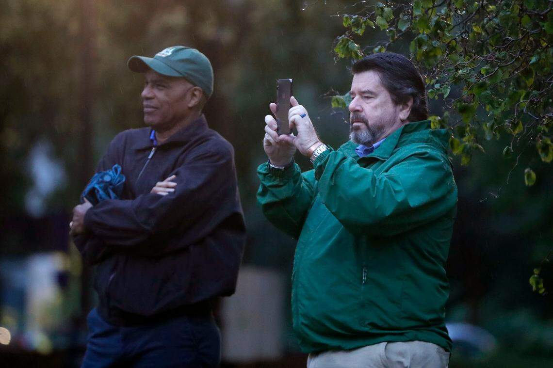 Orage Quarles, president and publisher of The News & Observer from 2000 to 2016, left, and Frank Daniels III, a former executive editor of The N&O, watch as the statue of Josephus Daniels is removed from Raleigh’s Nash Square early Tuesday morning, June 16, 2020.