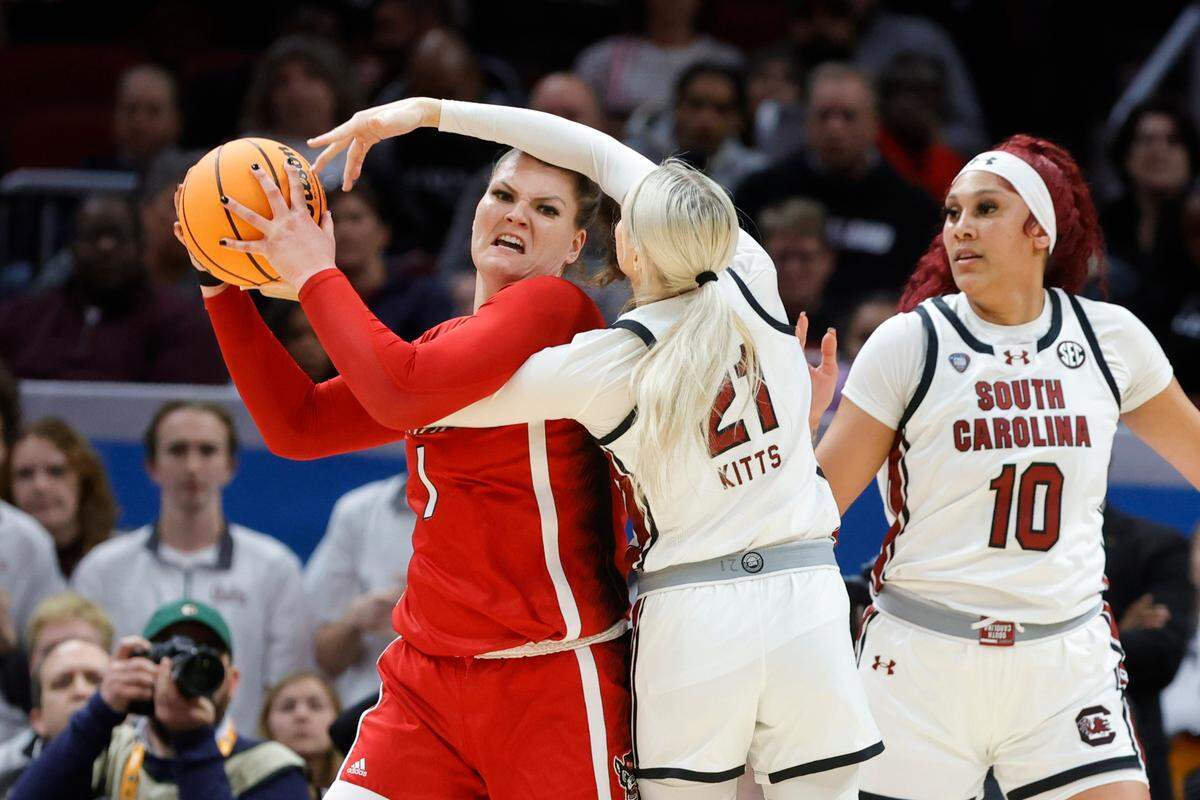 South Carolina’s Chloe Kitts (21) wraps up with NC State’s River Baldwin (1) during the Final Four game at Mortgage FieldHouse in Cleveland, Ohio on Friday April 5, 2024.