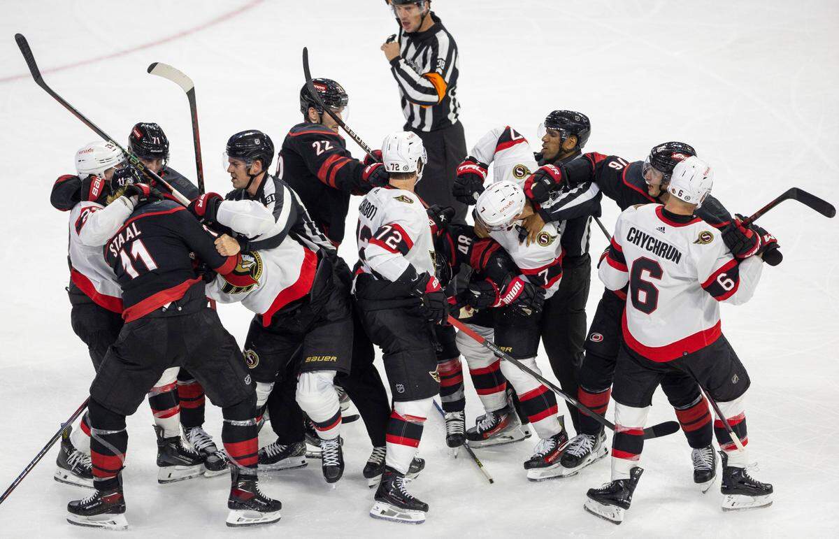 The Carolina Hurricanes Jordan Martinook (48) mixes it up with the Ottawa Senators Brady Tkachuk (7) during a fight in the second period on Wednesday, October 11, 2023 at PNC Arena, in Raleigh N.C.