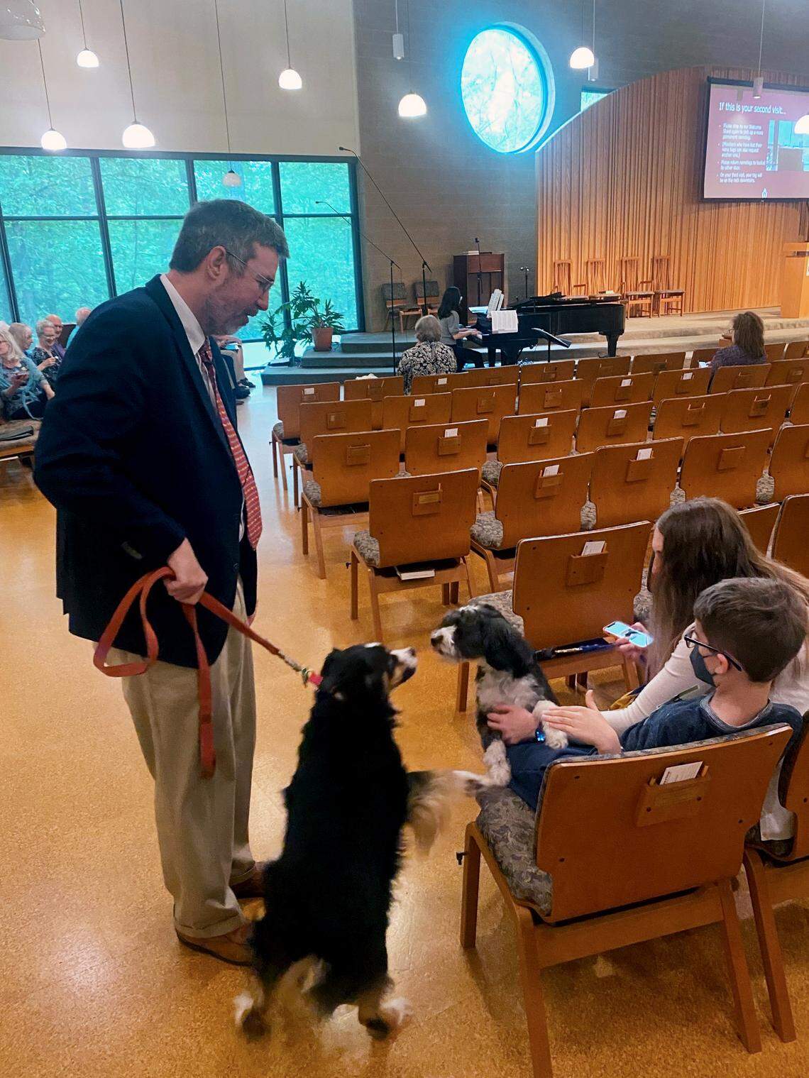 The Rev. James Kubal-Komoto and Yakumo greet the congregation at the blessing of the animals service at Unitarian-Universalist Fellowship of Raleigh