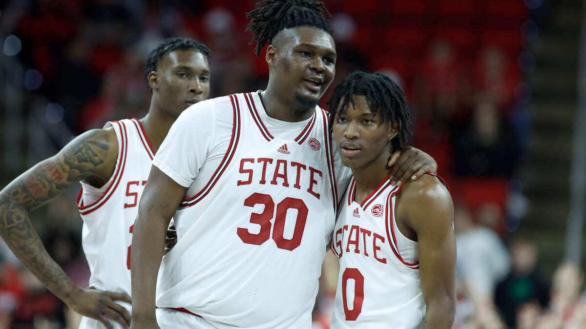 N.C. State’s D.J. Burns Jr. (30) talks with Terquavion Smith (0) during the second half of Clemson’s 96-71 victory over N.C. State’s game at PNC Arena in Raleigh, N.C., Saturday, Feb. 25, 2023.