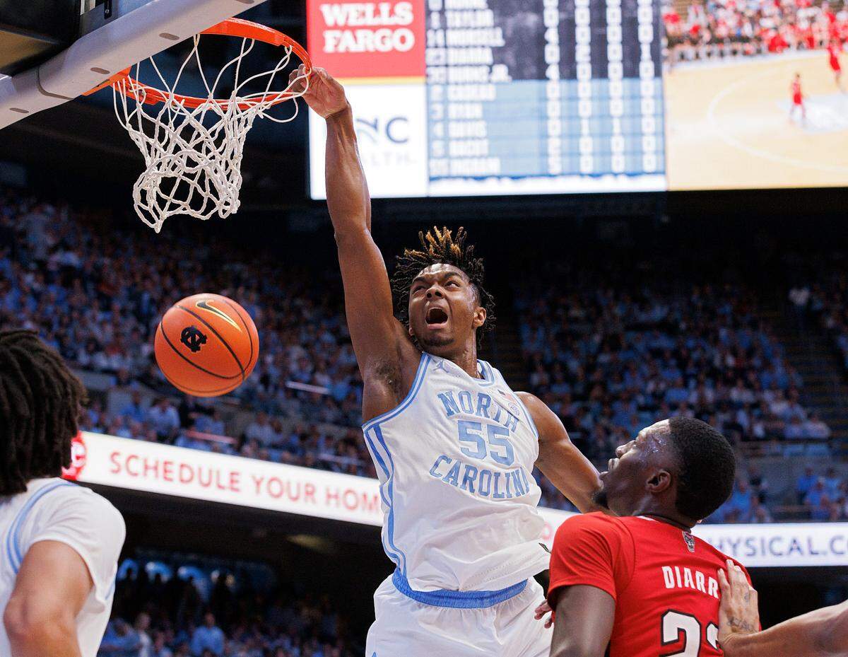 North Carolina’s Harrison Ingram reacts after slamming in two during the first half of the Tar Heels’ game against N.C. State on Saturday, March 2, 2024, at the Smith Center in Chapel Hill, N.C.