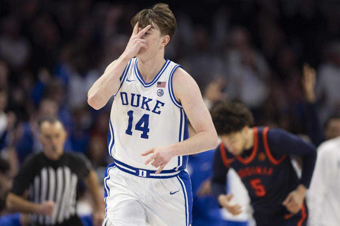 Duke guards Nikolas Khamenia (14) reacts after sinking a three-point basket in the second half against Virginia on Saturday, March 14, 2026, during the ACC Tournament Championship at Spectrum Center in Charlotte, N.C.