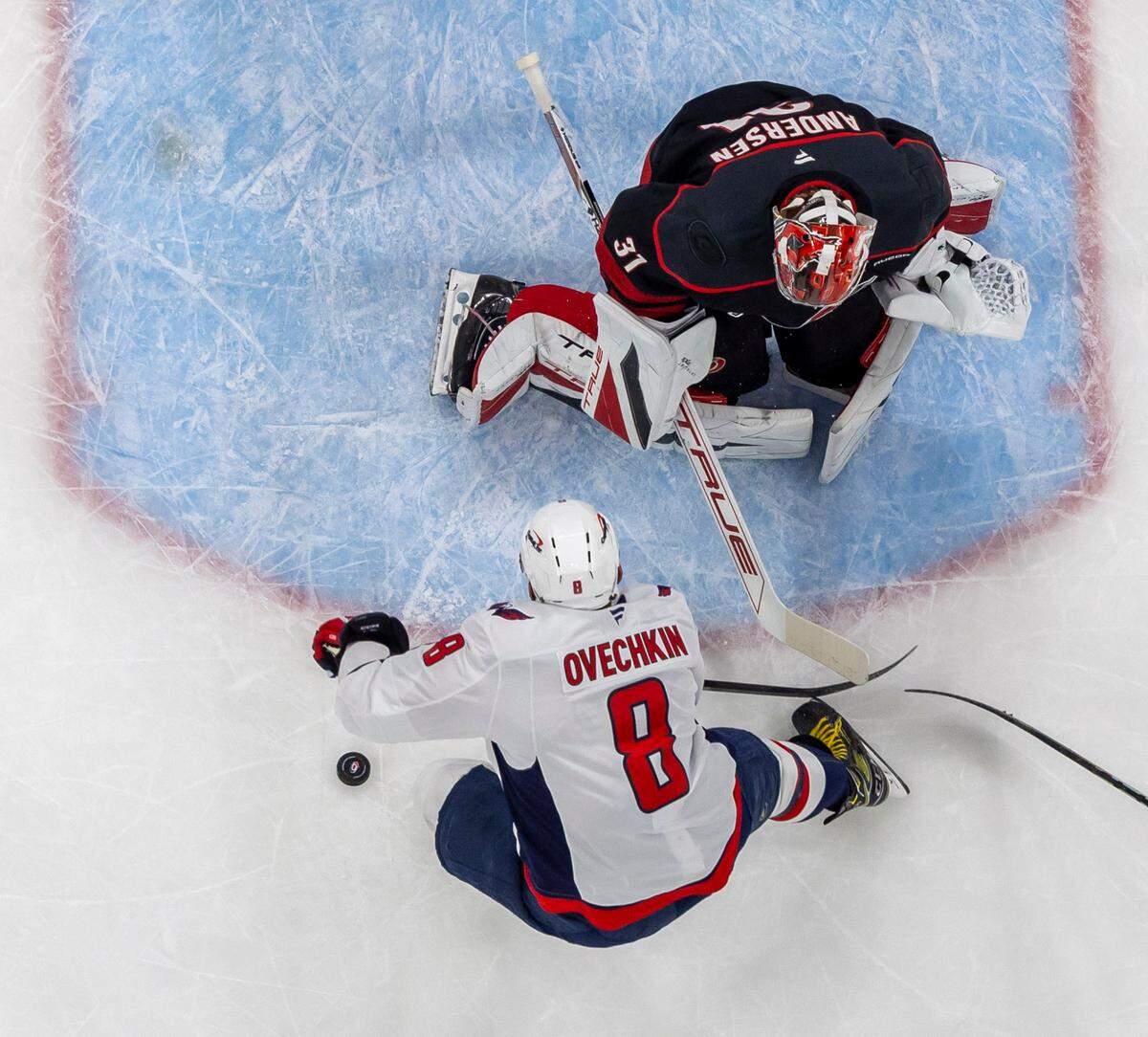 Carolina Hurricanes goalie Frederik Andersen (31) defends Washington Capitols left wing Alex Ovechkin (8) in the first period during Game 3 of their series on Saturday, May 10, 2025 at Lenovo Center in Raleigh, N.C.