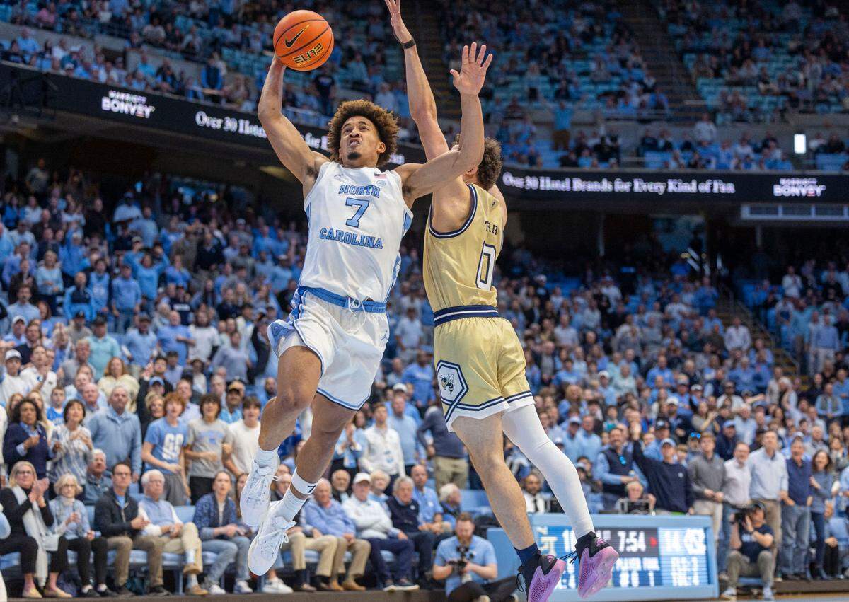 North Carolina guard Seth Trimble (7) drives to the basket against Georgia Tech’s Lance Terry (0) in the first half on Saturday, December 7, 2024 at the Smith Center in Chapel Hill, N.C