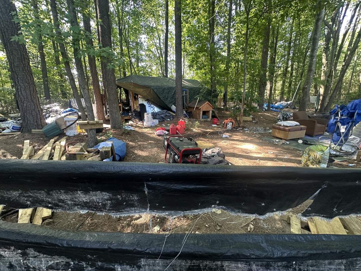 The camp near Exit 290 from Interstate 40 is strewn with trash, but also contains some comforts, including gas-powered generators.