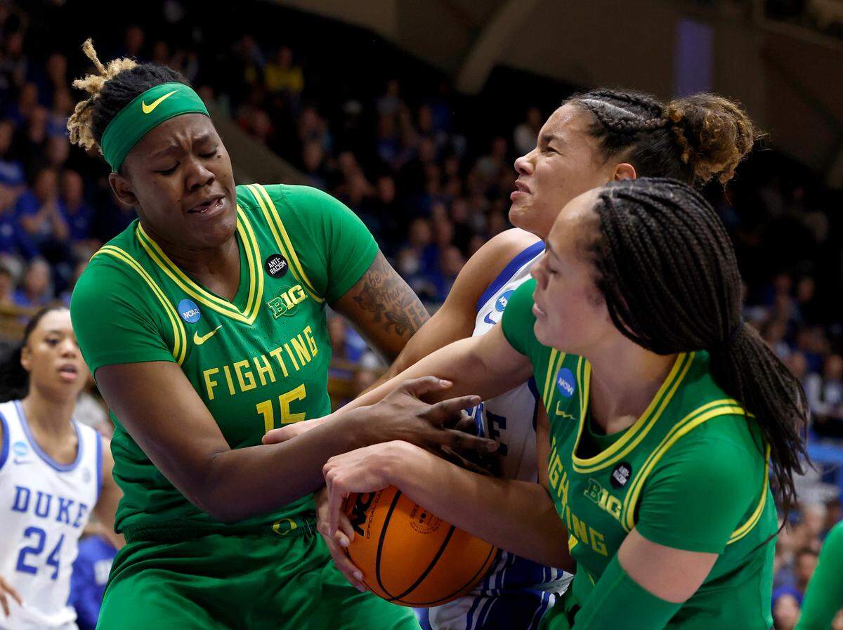 Duke’s Delaney Thomas battles for a rebound with Oregon’s Phillipina Kyei and Sofia Bell during the second half of the Blue Devils’ 59-53 win in the second round of the NCAA Tournament on Sunday, March 23, 2025, at Cameron Indoor Stadium in Durham, N.C.
