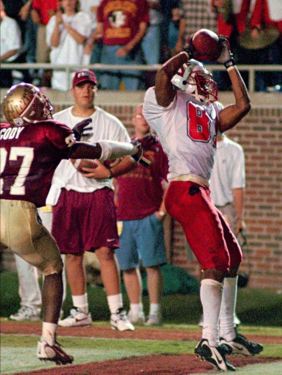 N.C. State’s Torry Holt hauled in one of his ACC record five touchdown passes against Florida State during a game in 1997.