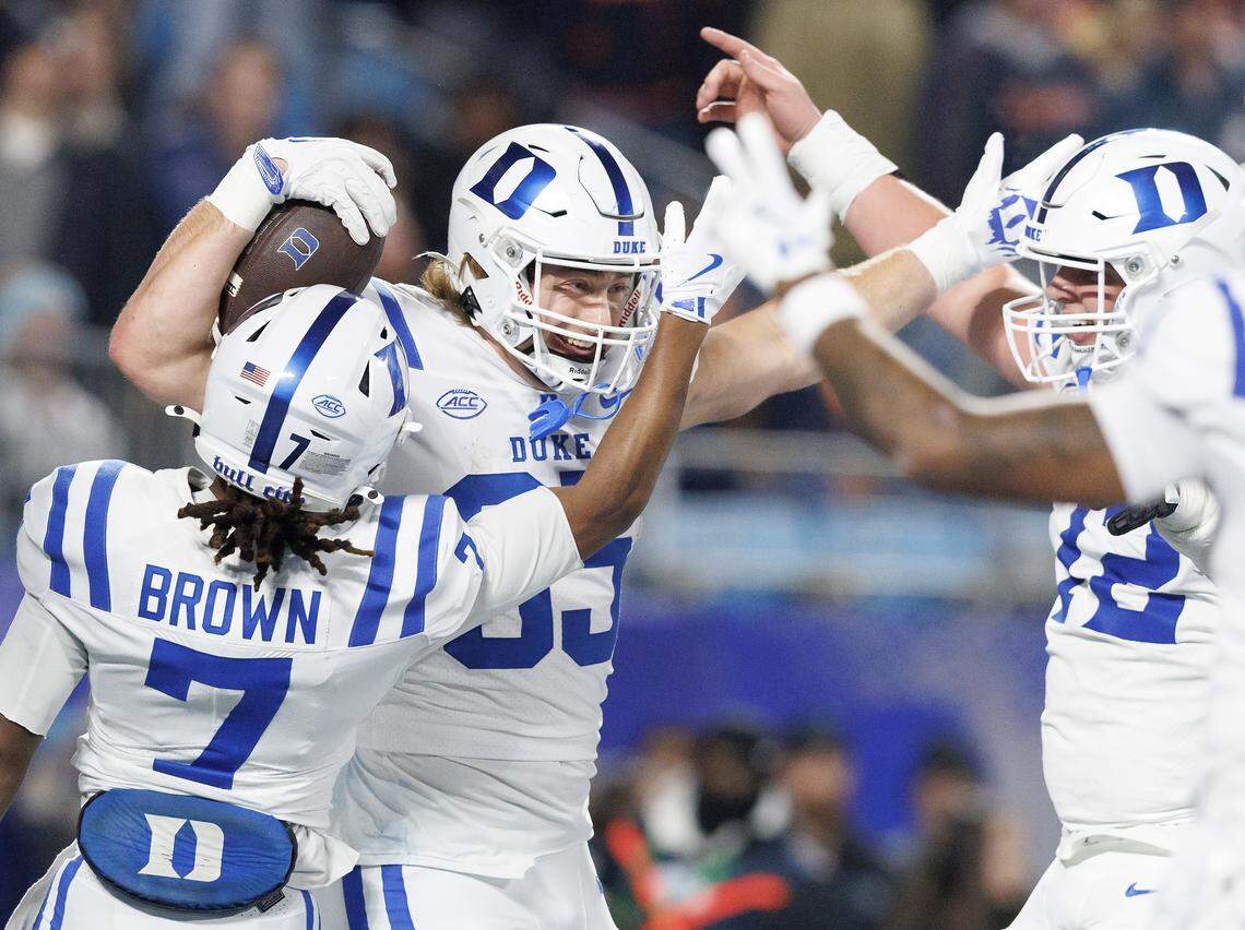 Duke’s Jeremiah Hasley (85) celebrates with teammates after scoring a touchdown during the first half of the ACC Football Championship against Virginia on Saturday, Dec. 6, 2025, at Bank of America Stadium in Charlotte, N.C.