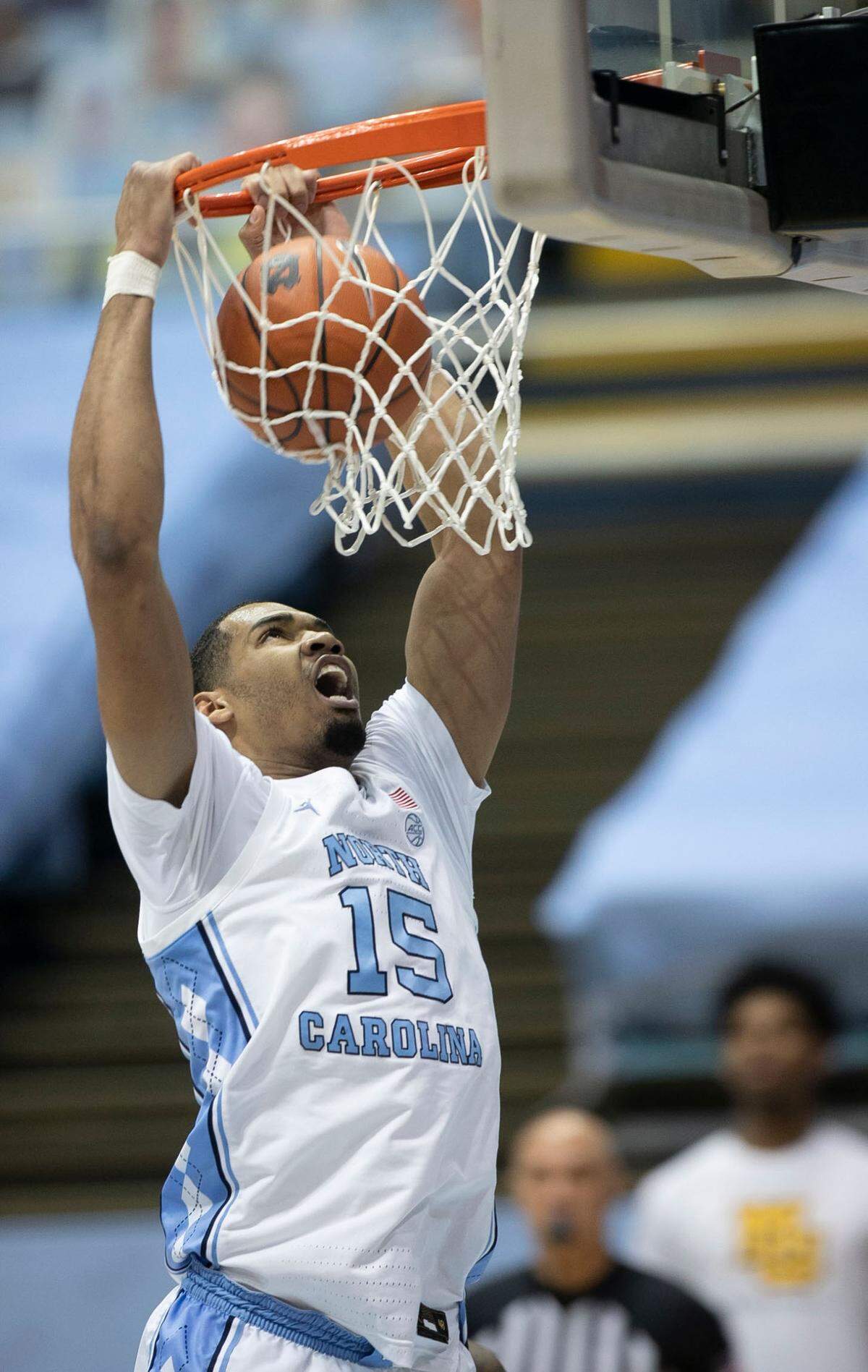 North Carolina’s Garrison Brooks (15) gets a dunk in the first half against Marquette on Wednesday, February 24, 2021 at the Smith Center in Chapel Hill, N.C.
