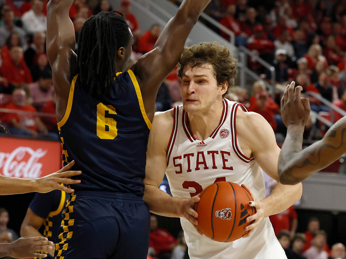 N.C. State’s Ben Middlebrooks posts up against Coppin State’s Julius Ellerbe III during the second half of the Wolfpack’s 66-56 win on Tuesday, Dec. 10, 2024, at Reynolds Coliseum in Raleigh, N.C.