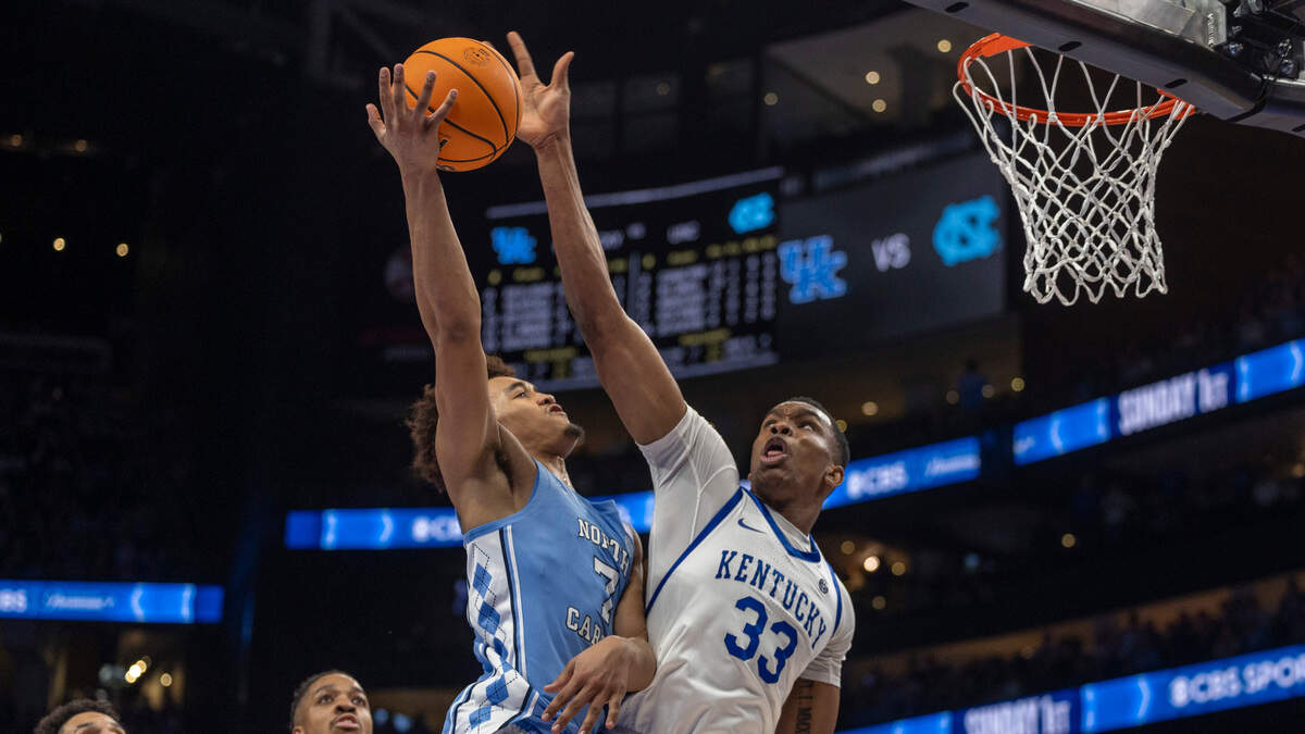 Kentucky’s Ugonna Onyenso (33) blocks a shot by North Carolina’s Seth Trimble (7) in the second half on Saturday, December 16, 2023 at State Farm Arena in Atlanta, Georgia.