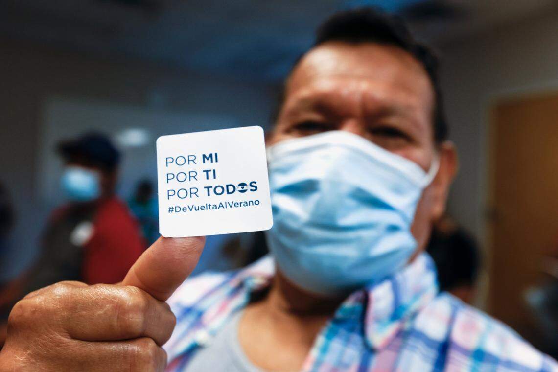 “For Me. For You. For Us’ Fidelino Caceres proudly displays a sticker he received after receiving his COVID vaccine at an event by the Episcopal Farmworker Ministry targeting members of the Hispanic community Saturday, Aug. 7, 2021.