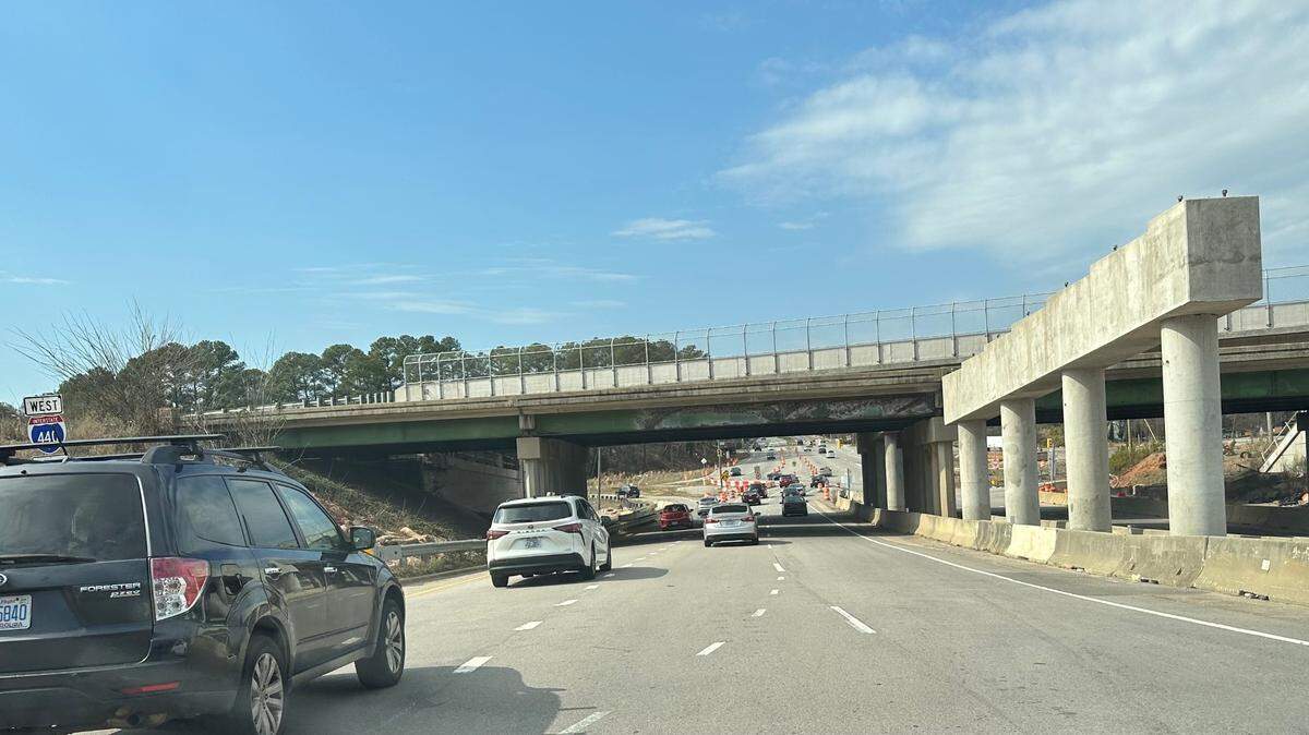 The bridge that used to carry eastbound lanes of the Raleigh Beltline over Western Boulevard, seen here in the foreground, will be gradually demolished over several nights starting in late February 2024.