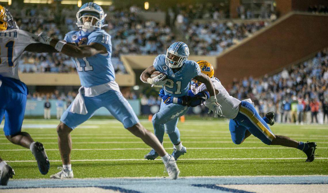 North Carolina’s Elijah Green (21) scores the game winning touchdown on a two yard run to give the Tar Heels’ 28-24 lead in the fourth quarter against Pitt on Saturday, October 29, 2022 at Kenan Stadium in Chapel Hill, N.C.