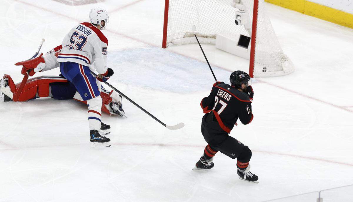 Carolina's Nikolaj Ehlers (27) celebrates after scoring the winning shot in overtime of the Hurricanes’ 3-2 overtime victory over the Canadiens in game two of the Eastern Conference Finals at the Lenovo Center in Raleigh, N.C., Saturday, May 23, 2026.