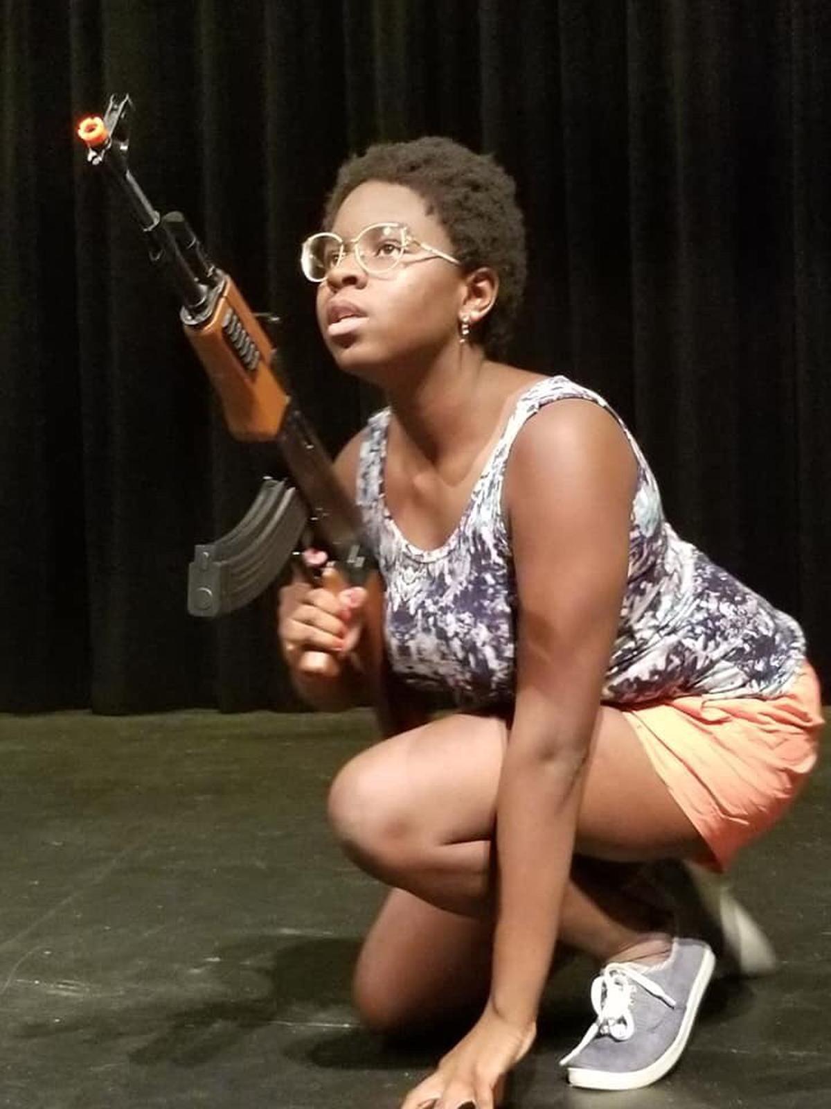 Amani Mckenzie as Girl in Women's Theatre Festival's "Eclipsed."