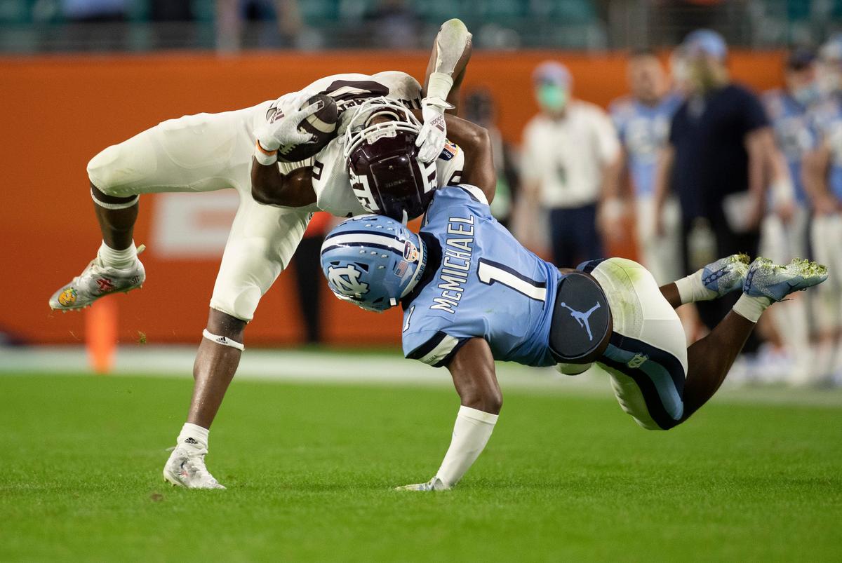 North Carolina’s Kyler McMichael (1) stops Texas A&M’s Ainias Smith (0) after a 14-yard pass completion in the third quarter during the Capital One Orange Bowl on Saturday, January 2, 2021in Miami Gardens, Florida.