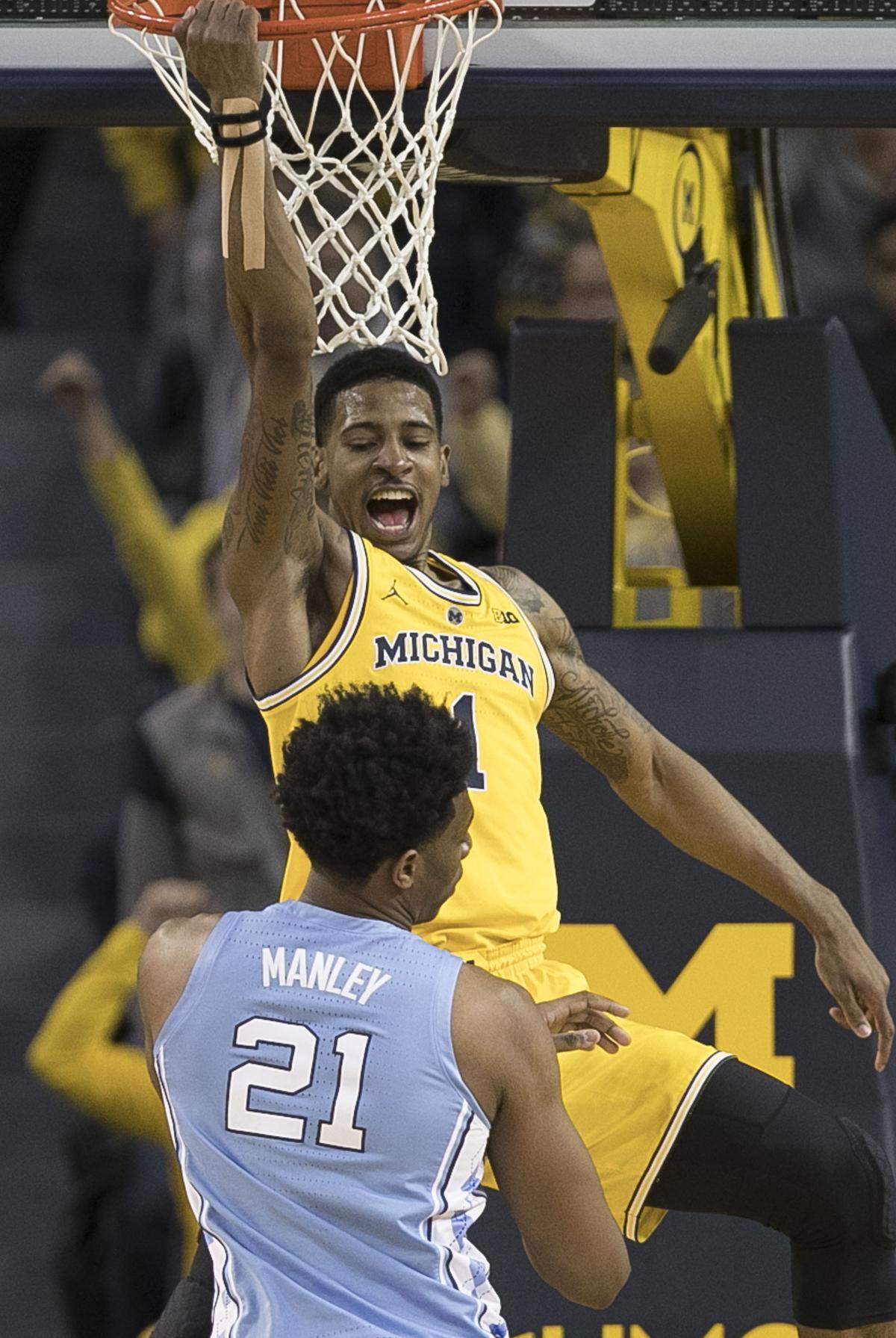 Michigan’s Charles Matthews (1) reacts after getting a dunk over North Carolina’s Sterling Manley (21) during the second half on Wednesday, November 28, 2018 during the ACC-Big Ten Challenge at Crisler Center in Ann Arbor, MI.