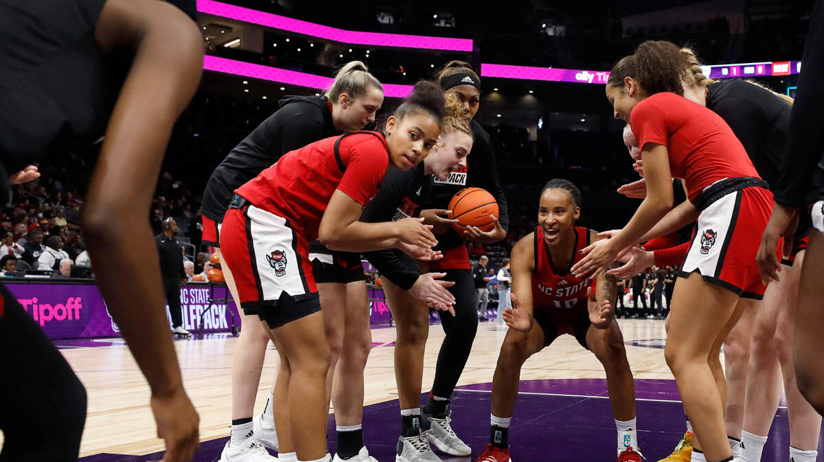 Teammates huddle around N.C. State’s Aziaha James prior to the Wolfpack’s game against top-ranked South Carolina on Sunday, Nov. 10, at Spectrum Center in Charlotte, N.C. James led the Wolfpack to a home win over James Madison on Thursday, Dec. 19.