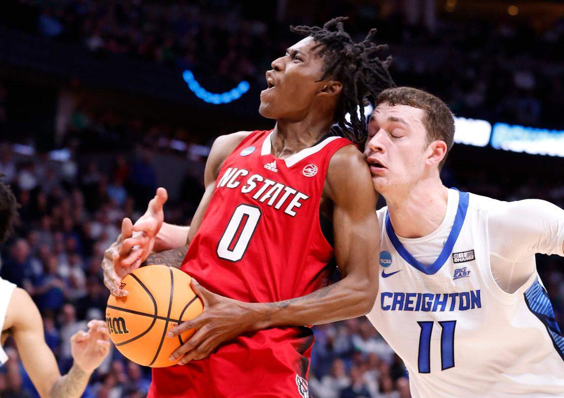Creighton’s Ryan Kalkbrenner (11) fouls N.C. State’s Terquavion Smith (0) during the second half of Creighton’s 72-63 victory over N.C. State in the first round of the NCAA Tournament at Ball Arena in Denver, Colo., Friday, March 17, 2023.