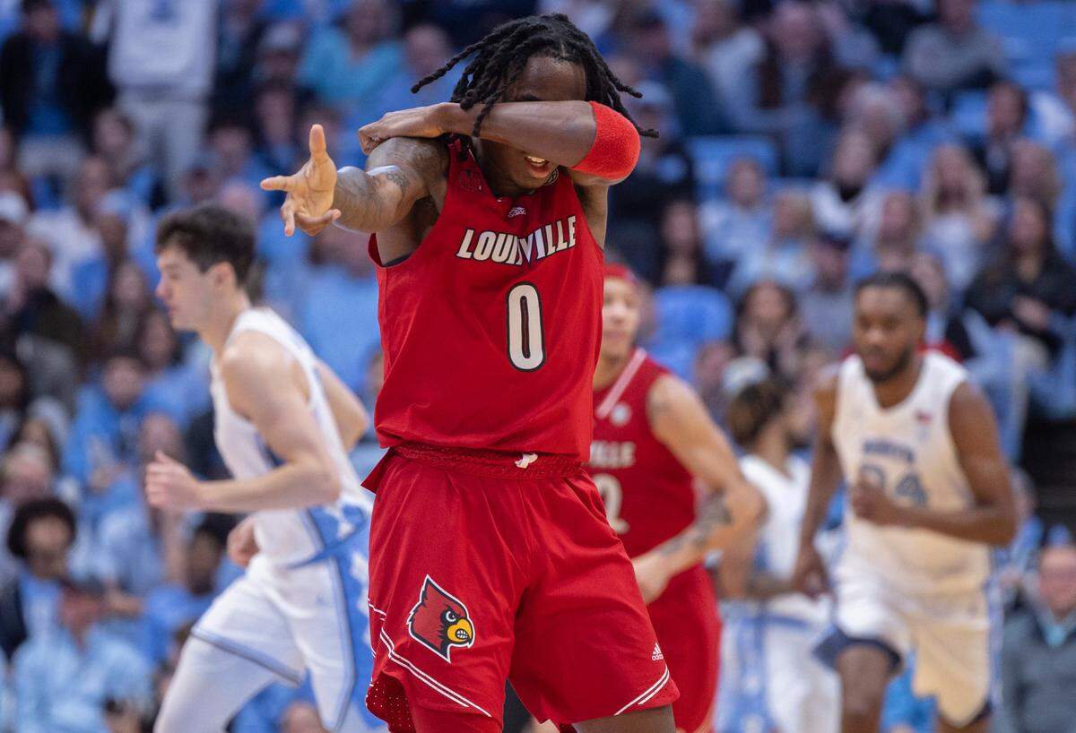 Louisville’s Mike James (0) reacts after sinking a basket to cut the North Carolina lead to five points in the second half on Wednesday, January 17, 2024 at the Smith Center in. Chapel Hill, N.C.