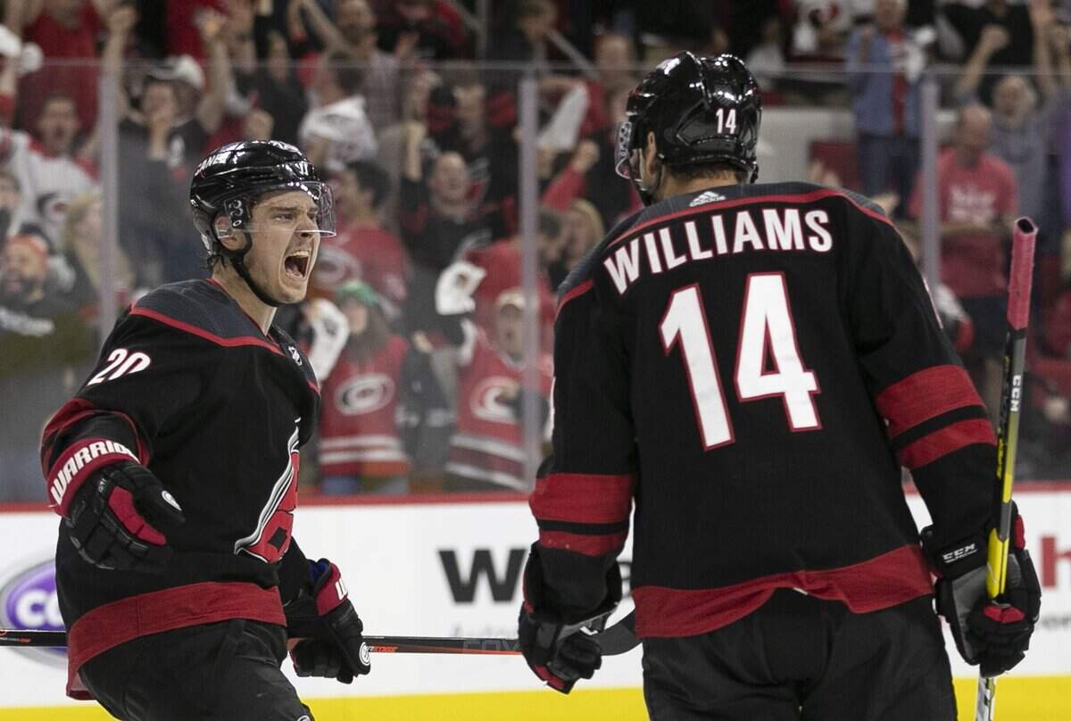 Carolina Hurricanes’ Sebastian Aho (20) celebrates with Justin Williams (14) after Williams scored the game winning goal on New York Islander goalie Robin Lehner (40) during the third period of Game 3 of their second round Stanley Cup series on Wednesday, May 1, 2019 at PNC Arena in Raleigh, N.C. The Canes rolled to a 5-2 victory,