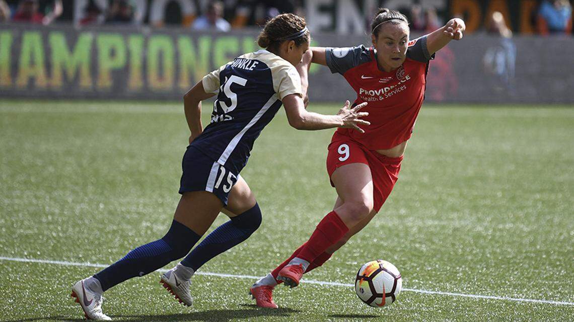 Portland Thorn’s Caitlin Foord, right, battles North Carolina Courage’s Jaelene Hinkle, left, for the ball during the National Women’s Soccer League championship game in Portland, Ore., on Saturday.