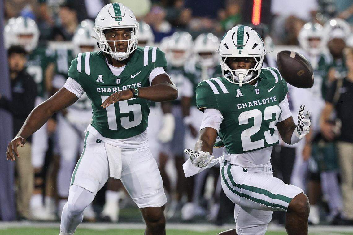 Charlotte quarterback Connor Harrell, left, and runningback CJ Stokes react as the snap is fumbled and the ball beomes loose during the game against Chapel Hill at Jerry Richardson Stadium in Charlotte on Saturday, September 6, 2025.