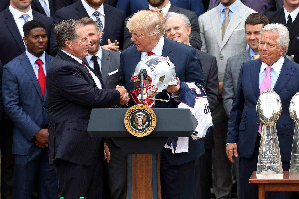 New England Patriots head coach Bill Belichick presents President Donald Trump with a Super Bowl LI team helmet at a ceremony honoring the Super Bowl LI champion Patriots on the South Lawn at the White House in April 2017.