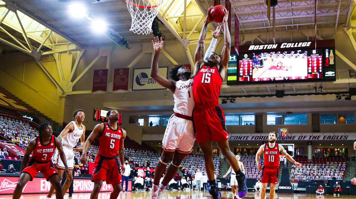 N.C. State’s Manny Bates grabs a rebound against Boston College Saturday, Feb. 6, 2021.