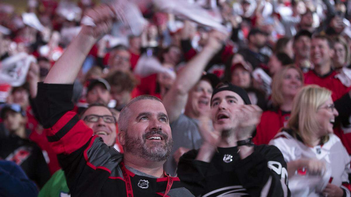 Carolina Hurricanes fan Tim Kennedy of Wake Forest, N.C. welcomes the team to the ice for game five against Boston on Tuesday, May 10, 2022 at PNC Arena in Raleigh, N.C.